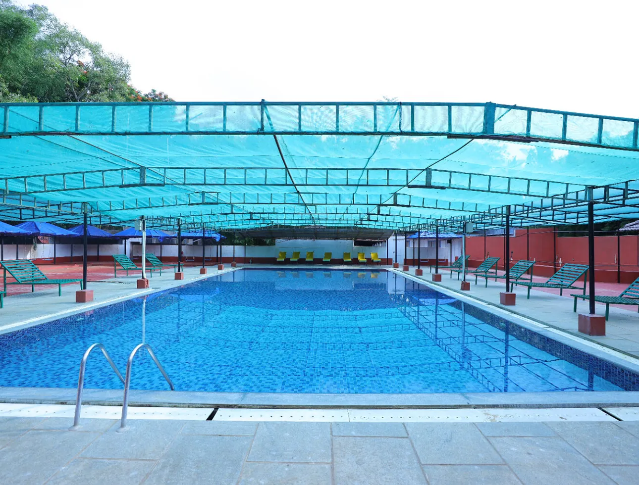poolside relaxation at scenic nature resort Karnataka