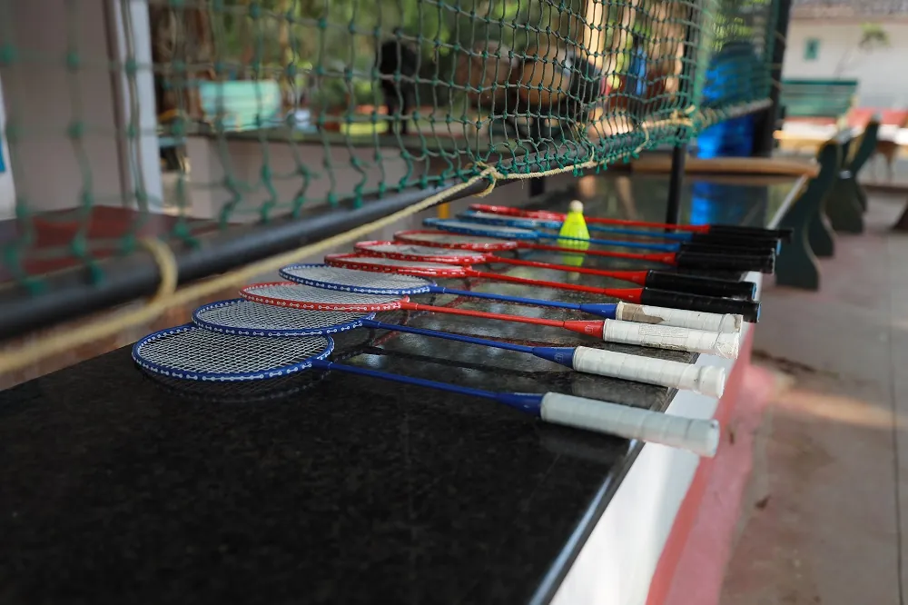 outdoor badminton court at resort near Bangalore